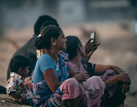 Image of women using smartphone in rural India